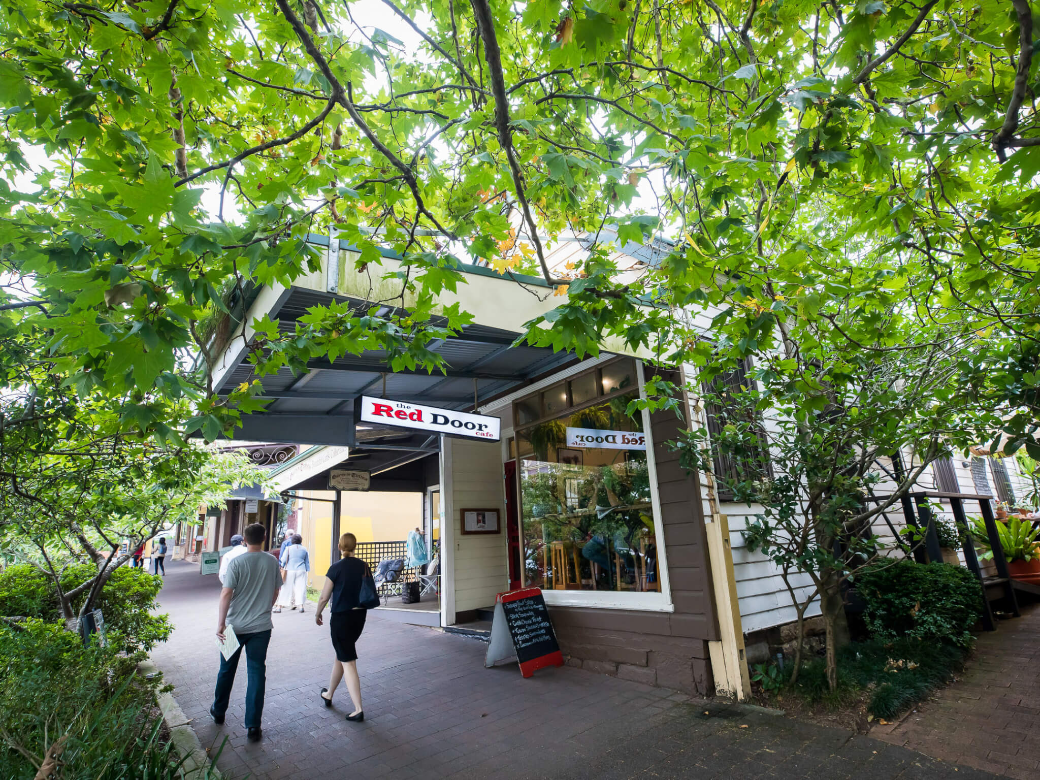 Red Door Café, Leura Charming exterior of the Red Door Café in Leura, with its inviting red door and cozy atmosphere.