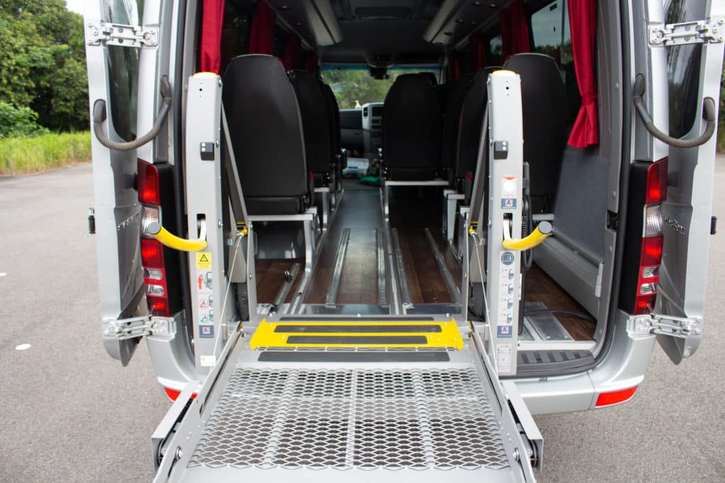 Sprinter luxury bus wheelchair lift fitted position.